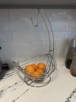 Swinging hammock fruit and banana holder 