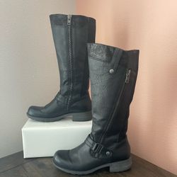 Earth Origins "Portia” Black” Leather Knee-High Riding Boots. These boots combine streamlined moto elements with casual riding-boot styling. They are 