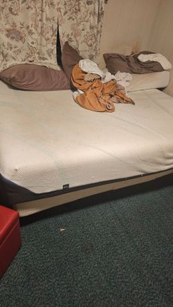 Queen sized bed with motorized bed frame