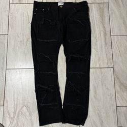 Black Ripped stacked jeans 38/34