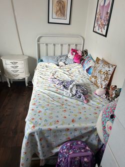 White twin metal frame bed
