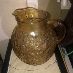 Old amber glass pitcher
