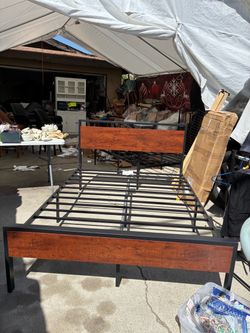 Full size brown metal bed