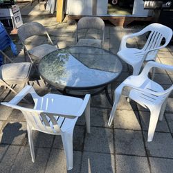 Small Table And Six Random Chairs 