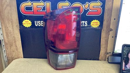 16 20 Toyota Tacoma LH Tail Light OEM. Black