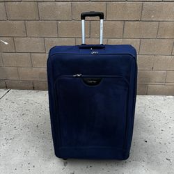 Two oversized suitcases, one of which was a Calvin Klein, were sold for a low price of $15 because one of the wheels was broken.