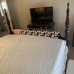 Haverty’s California king bed dark wood