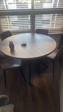 Brown 45’ round dining table