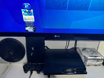 PlayStation 3 slim with games and controller