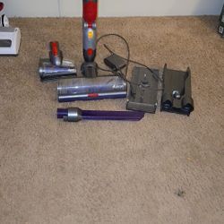 Dyson  Dyson V15 Detect Absolute cordless vacuum cleaner and its attachments. Key features of the Dyson V15 Detect Absolute