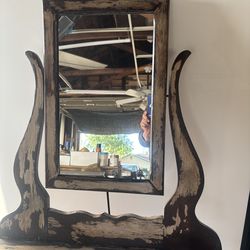 Antique wall mirror with shelf