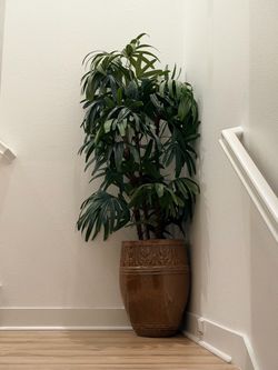 2 faux plants and pots