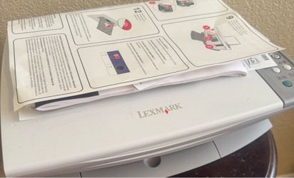 Lexmark printer with paper and 2 ink cartridges