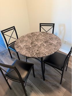 Marble top table and 4 black chairs