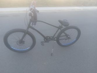 Matte Black Cruiser Bike with Blue Rims