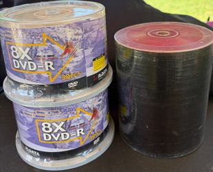 3  RiDATA 8X DVD-R 50-pack recordable  discs  alongside an open spindle of shiny media discs