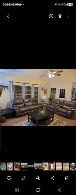 Dark Gray Leather Reclining Sofa and Loveseat Set