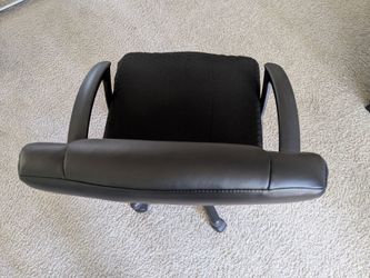 Table and swivel office chair