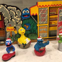 4 Sesame Street Ornaments With A Backdrop
