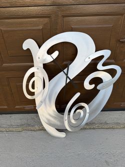 Arti & Mestieri modern abstract wall clock featuring, 