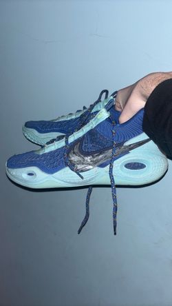 (send offer)Size 9 Nike Cosmic Unity basketball shoe in a blue, teal, and light blue colorway