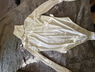 ribbed white bodysuit with snap closures.