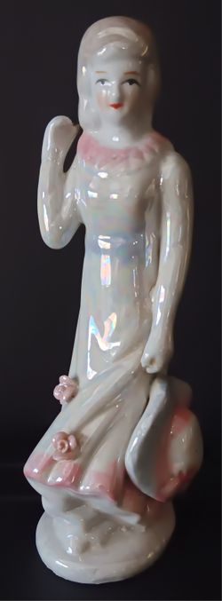 Porcelain Irradesent Girl Figurine With Flower Dress And Bow Hat 7" Tall.