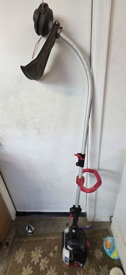 Very lightly used homelite curved weed eater