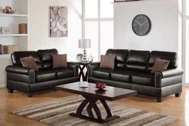 Brown faux leather sofa and love seat set