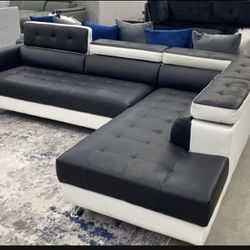New black and white is a sectional with free delivery