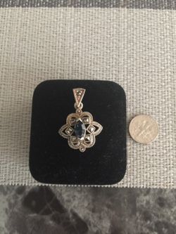 926 Sterling silver charm with marcasite stone and blue zirconia $15