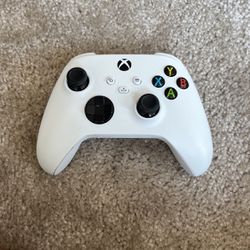 two xbox controllers