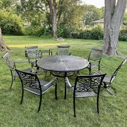 Large Cast Aluminum 10pc Patio Set, Table Is 60” Diameter, 7 Chairs, 2 Of Them Are Swivel, 2 Foot Ottomans, Freshly Painted, Looks Like New 