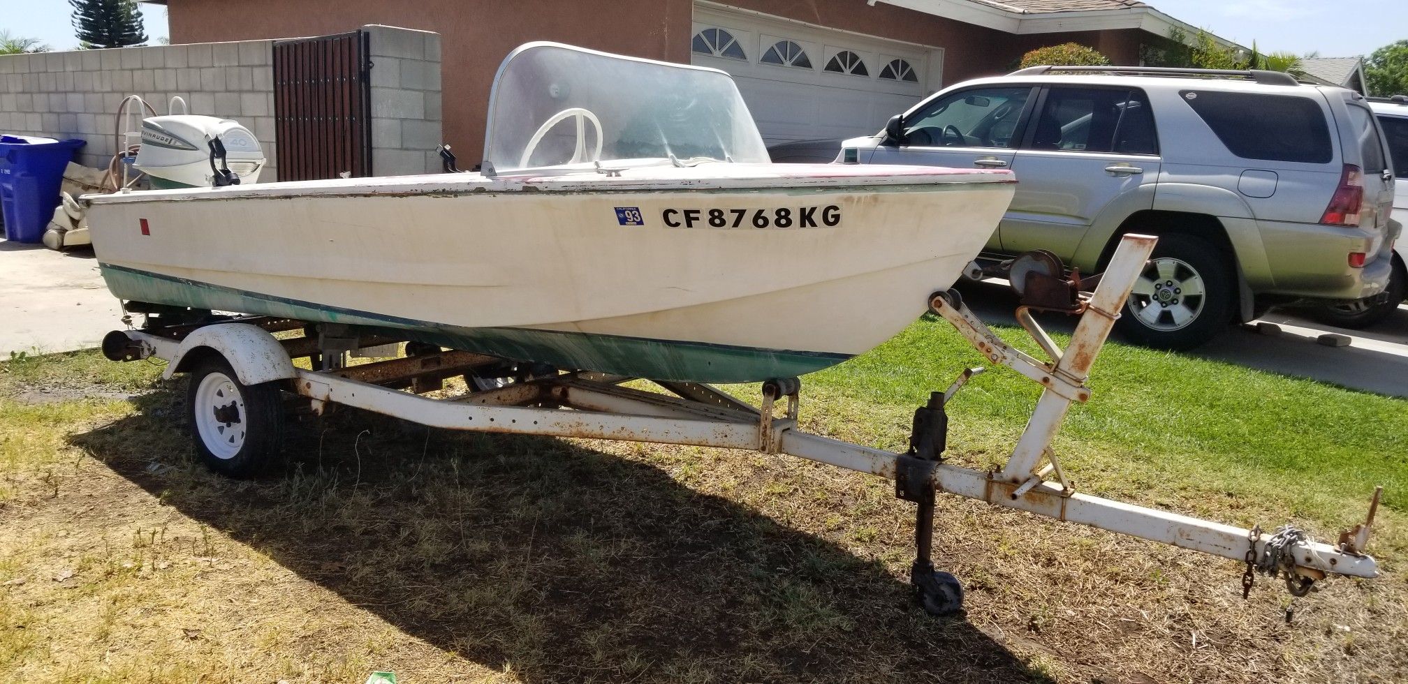 14 ft Glasspar boat and trailer with Evinrude outboard motor