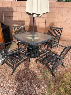 Patio table chairs and umbrella