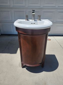 24 inch Single Freestanding Vanity Plus Waterfall 8" faucet with. Like New. $120