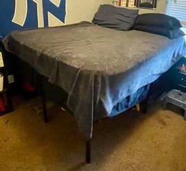 Queen sized mattress, boxspring, and metal frame