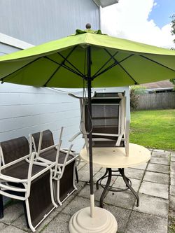Patio table 6 chairs and umbrella with stand .