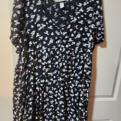 Black dress with white and purple flowers and green leafs