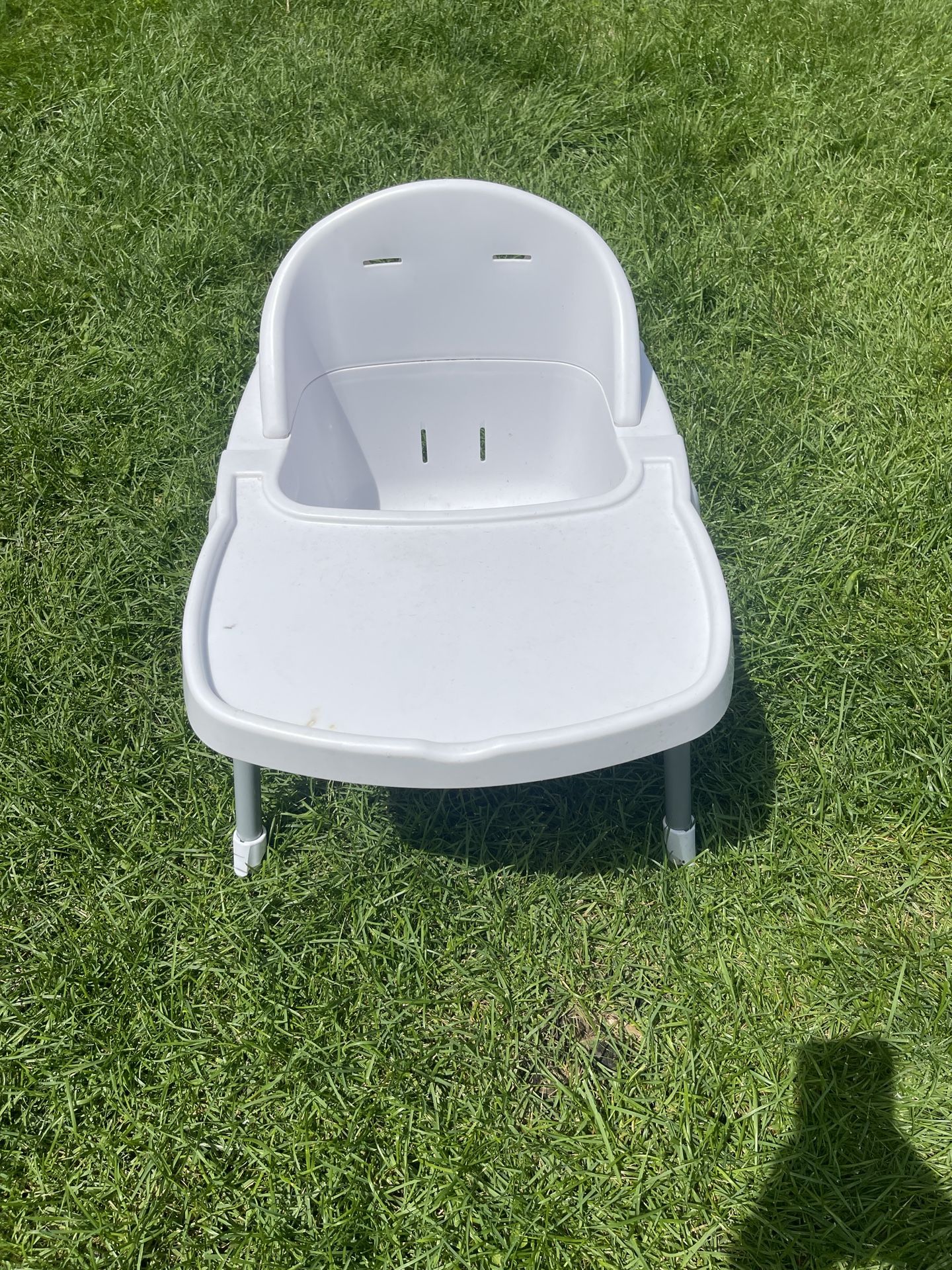 high chair with a tray.
