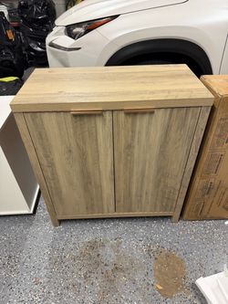 Light Oak Two-Door Storage Cabinet