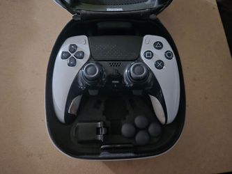 Used PS5 edge controller with case and mod accessories.