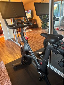 Peloton with swivel screen and shoes