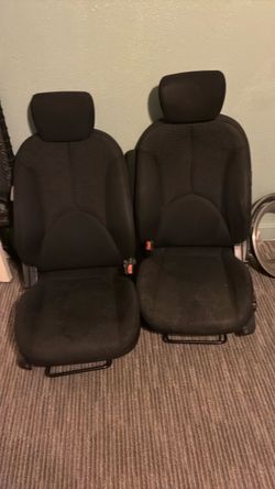 Two recallable bucket chairs