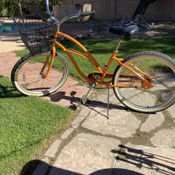 Like New step thru Orange,Electra Cruiser bicycle. 26” tires. 17 1/2” frame,