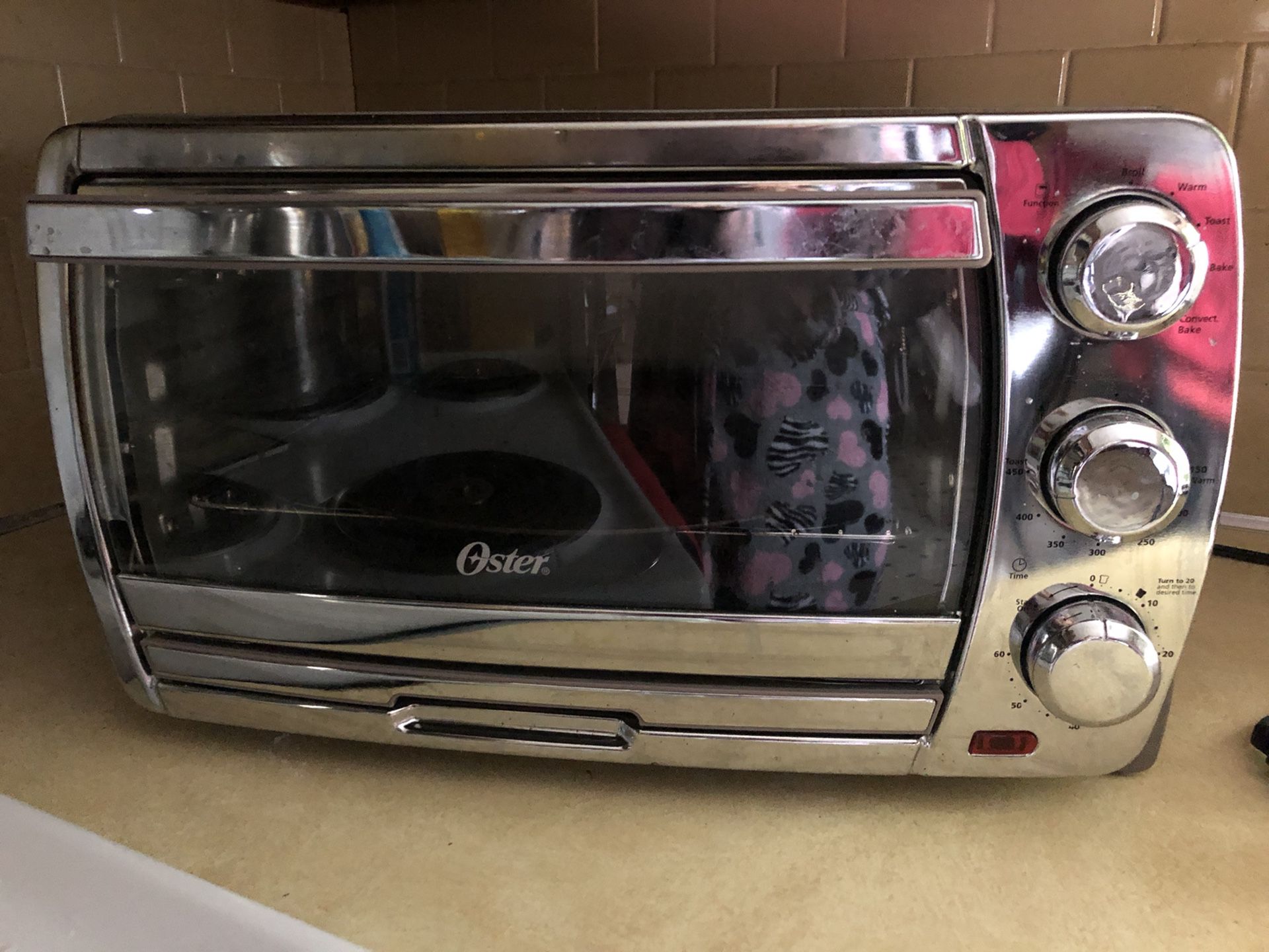 Oster, toaster oven with four accessories