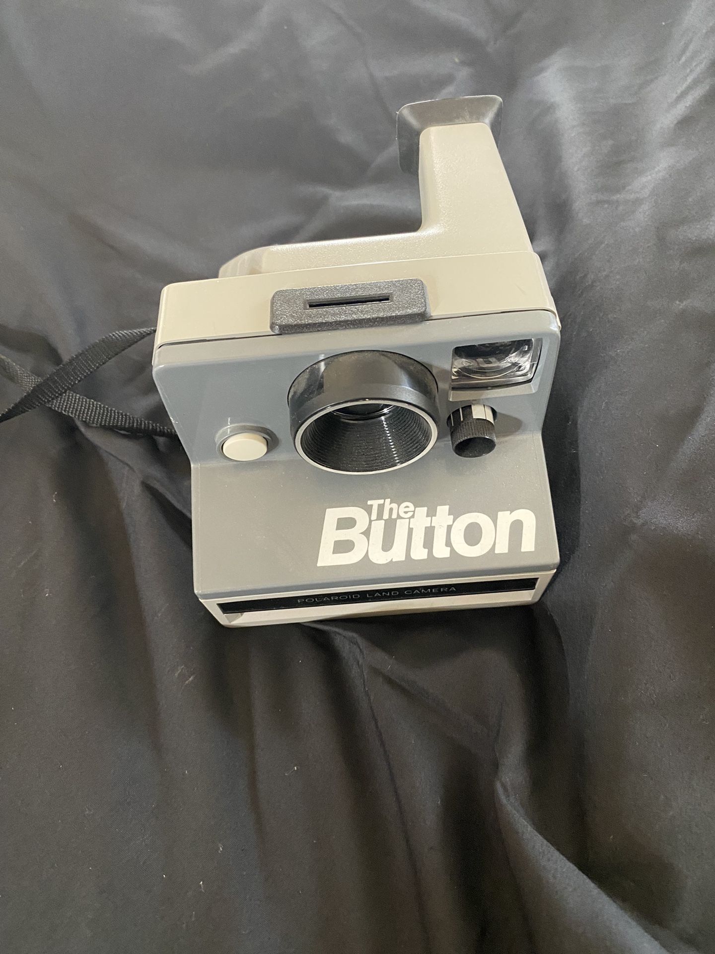 The Button Polaroid Land Camera