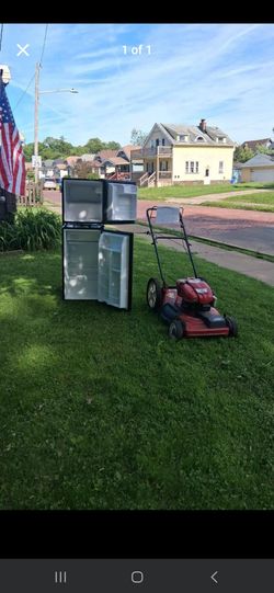 Mini freezer and  mini fridge  and lawnmower  all work