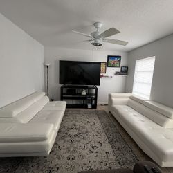 2 white leather sofas, $400