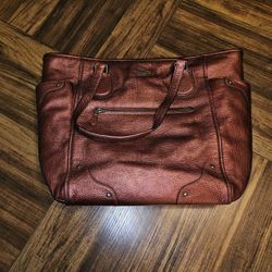 Coach metallic cherry pebbled leather large "Mickie" tote bag with gunmetal hardware.